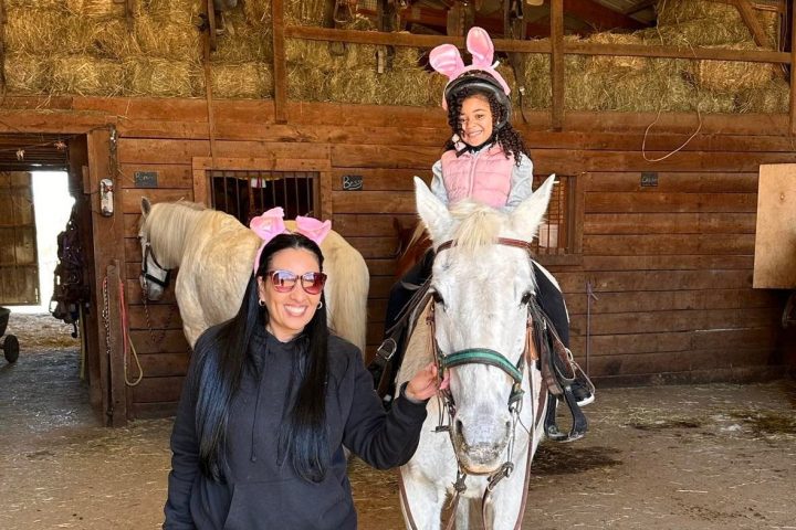 a man and a woman standing in front of a building