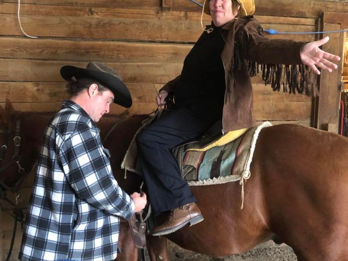 a person sitting on a horse