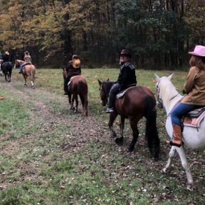 a group of people riding on the back of a horse