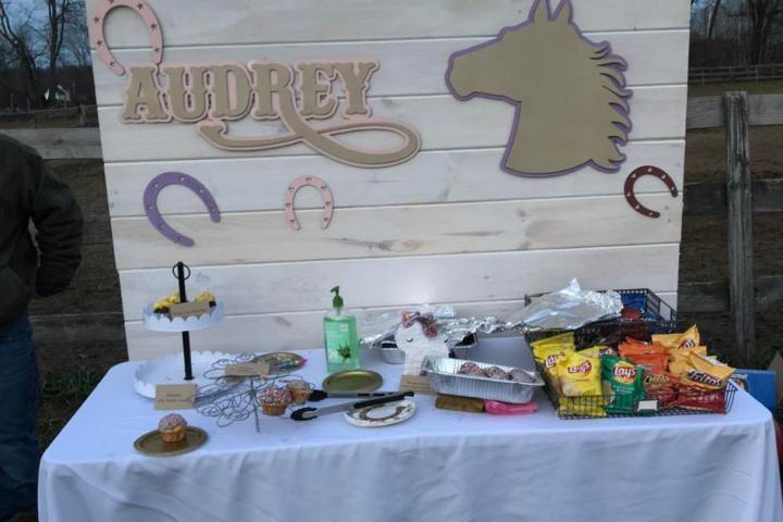 a person sitting at a table with a cake