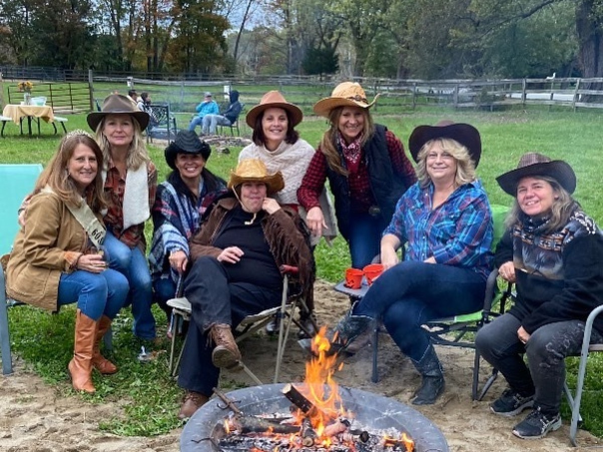 a group of people sitting at a park