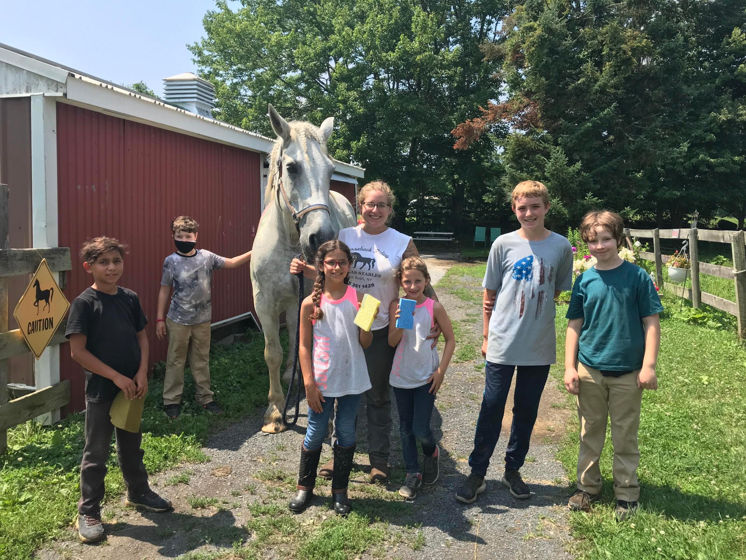 a group of people standing in front of a crowd posing for the camera