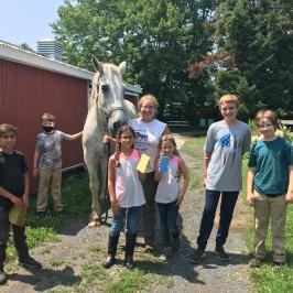 a group of people standing in front of a crowd posing for the camera