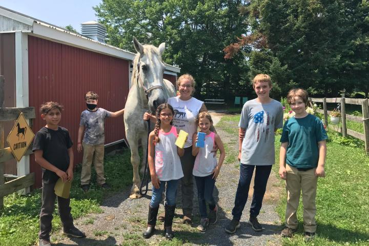 a group of people standing in front of a crowd posing for the camera