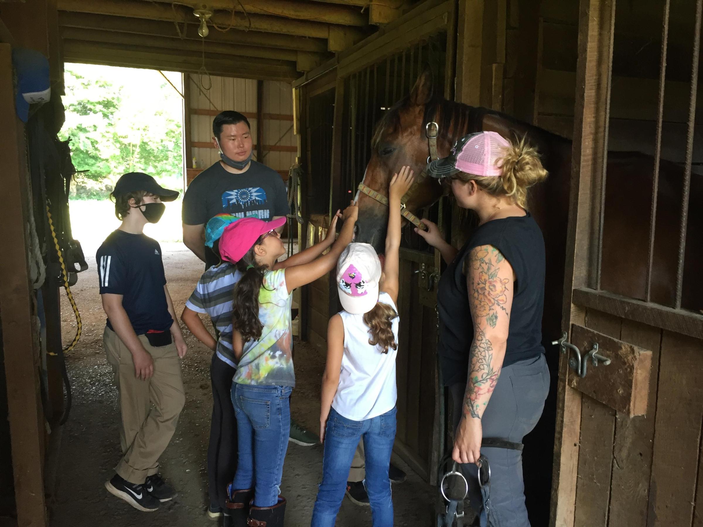 a group of people standing in front of a window