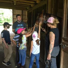a group of people standing in front of a window