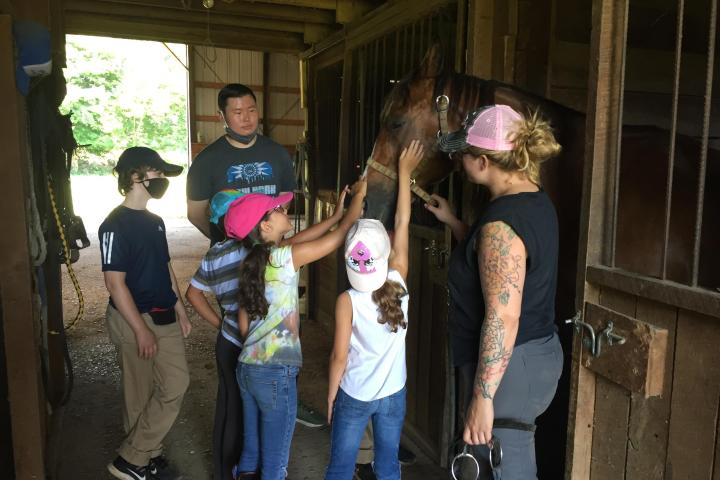 a group of people standing in front of a window