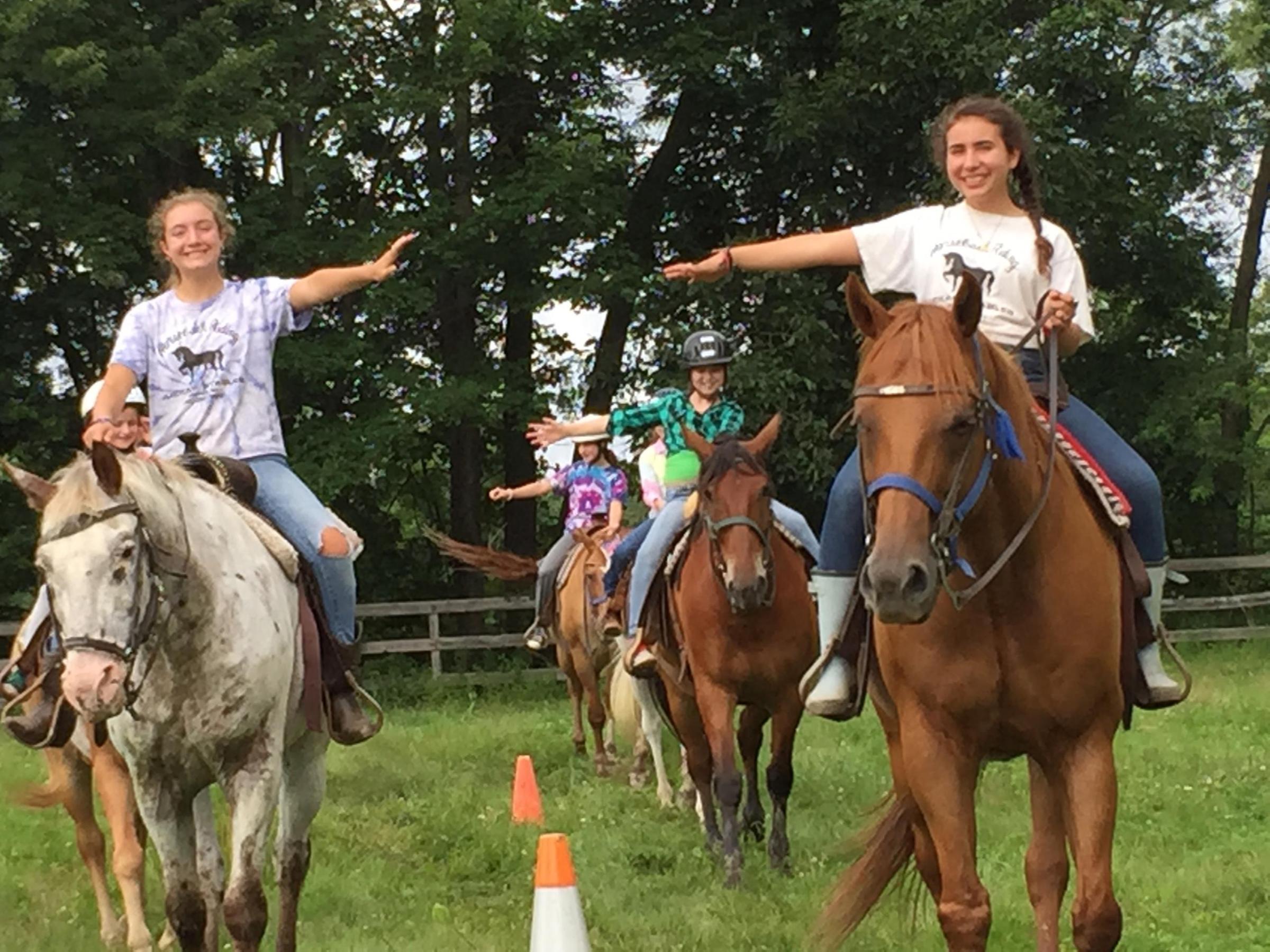 a group of people riding on the back of a horse