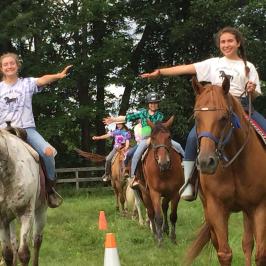 a group of people riding on the back of a horse