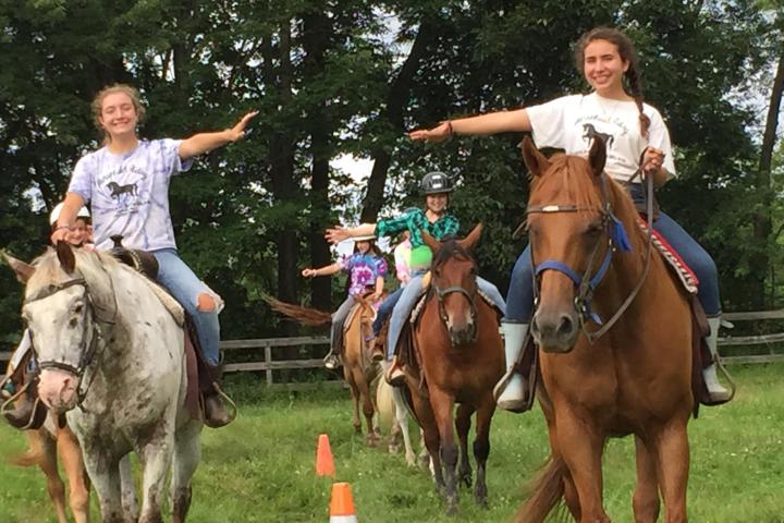 a group of people riding on the back of a horse