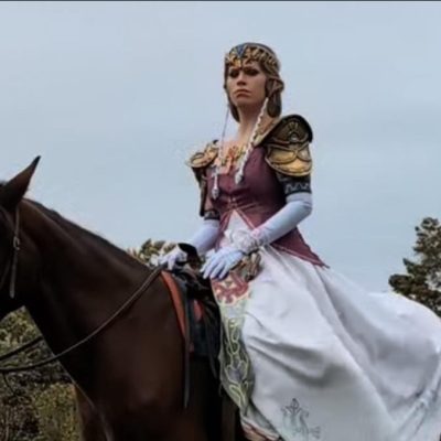 a person riding on the back of a brown horse