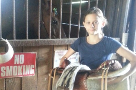a person standing in front of a fence