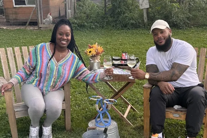 a group of people sitting at a picnic table