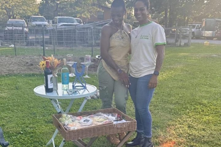a man that is standing in the grass