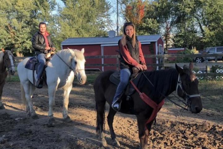 a group of people riding on the back of a horse