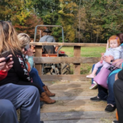 a group of people sitting on a bench