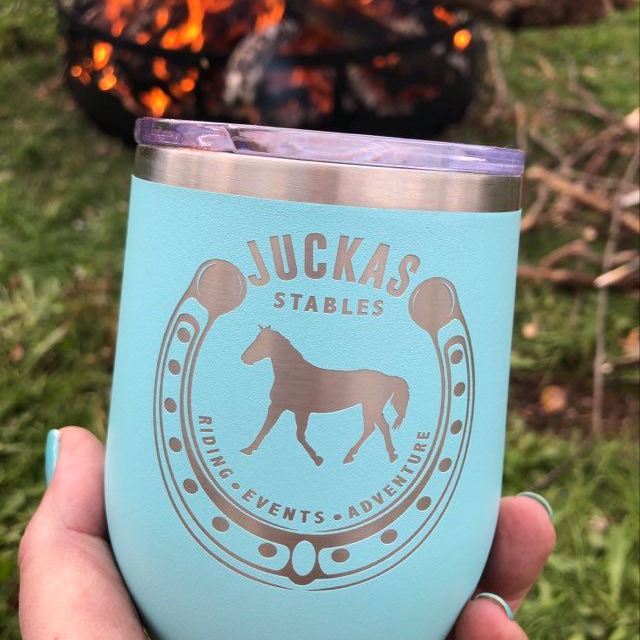 a hand holding a cup