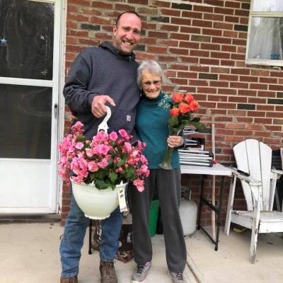 a person standing in front of a brick building