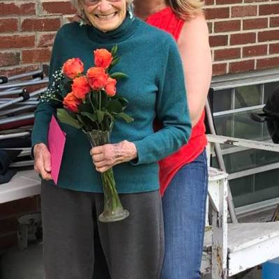 a woman standing in front of a building