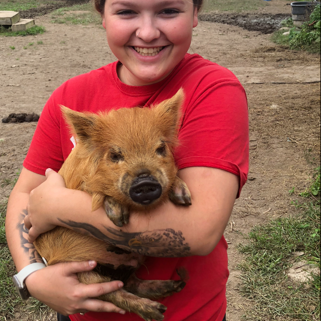 a young boy holding a teddy bear