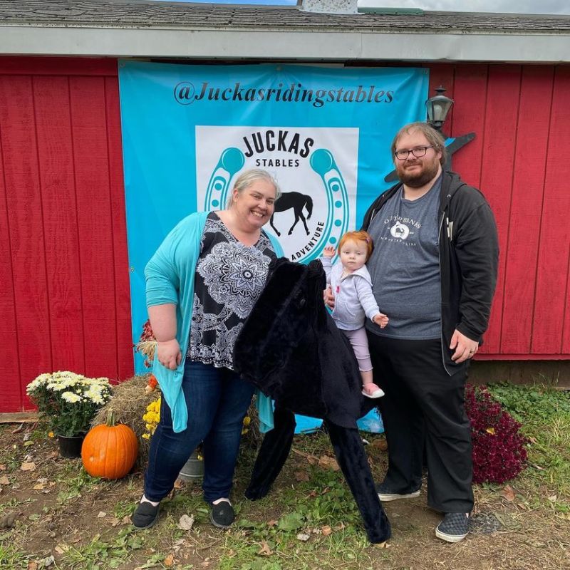 a person standing in front of a group of people posing for the camera