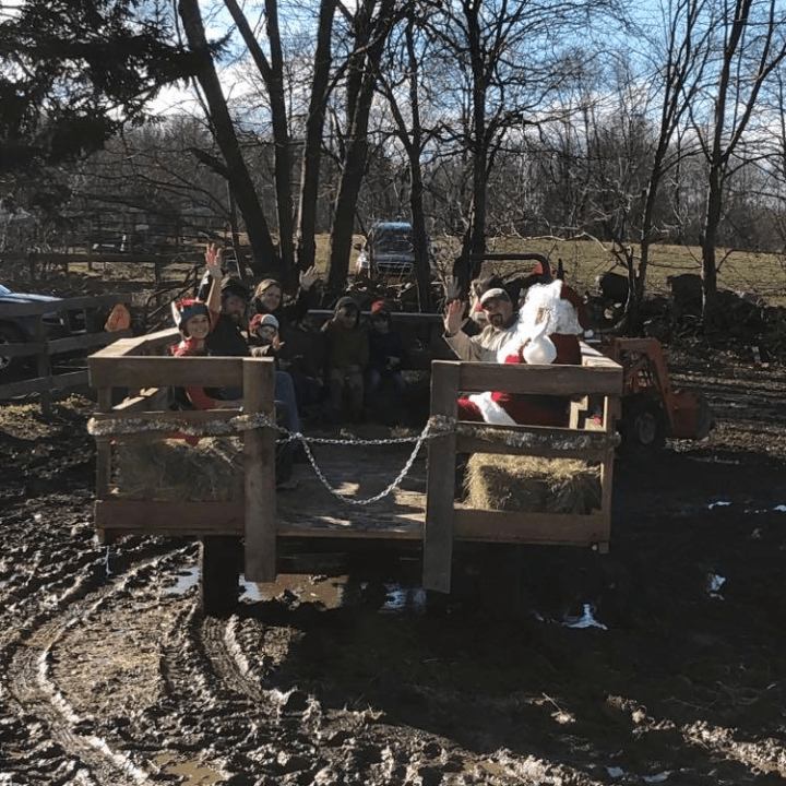 a group of people sitting on a bench in a park