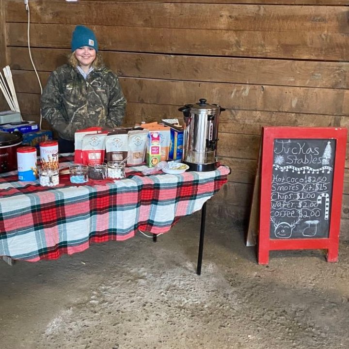 a person sitting on a suitcase