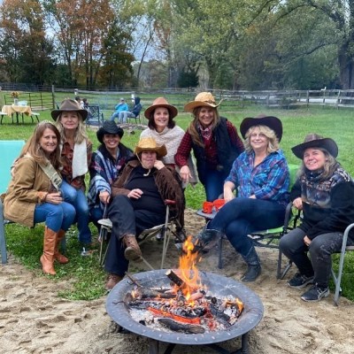 a group of people sitting at a park