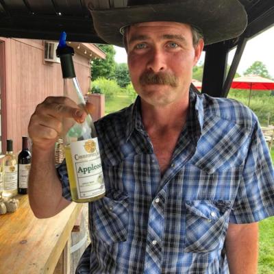 a man holding a glass of wine