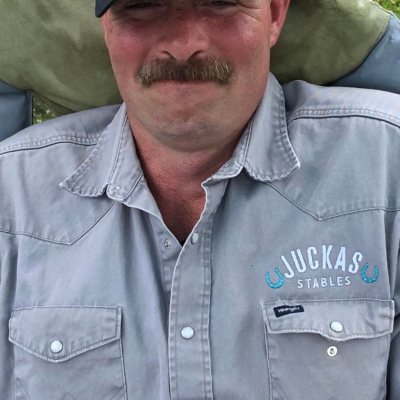 a man wearing a hat and glasses