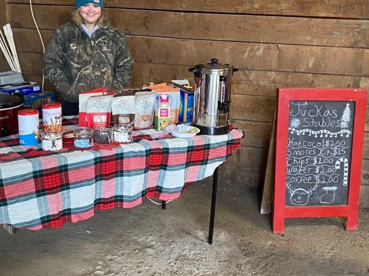 a person sitting on a suitcase