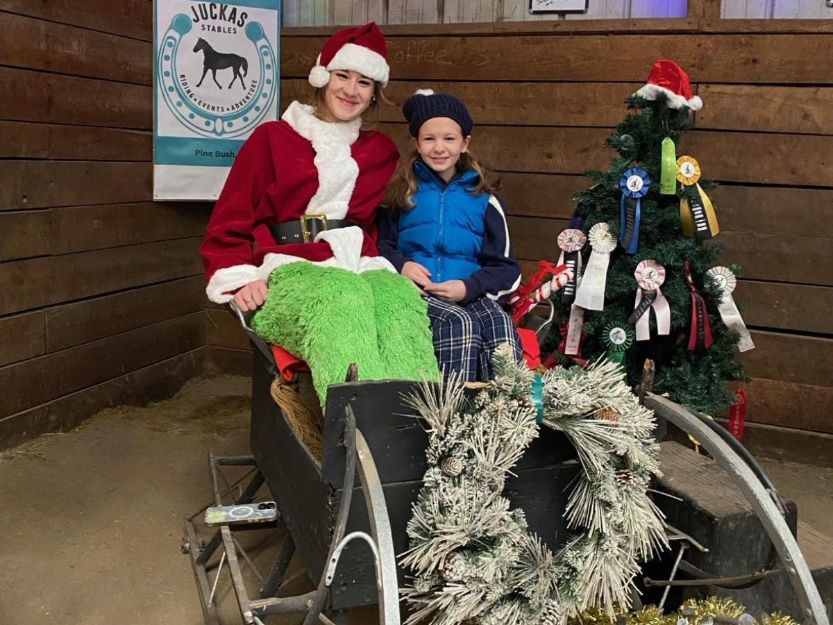 Tessa Allen riding on the back of a bicycle