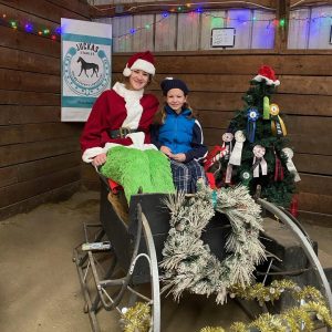 Tessa Allen riding on the back of a bicycle