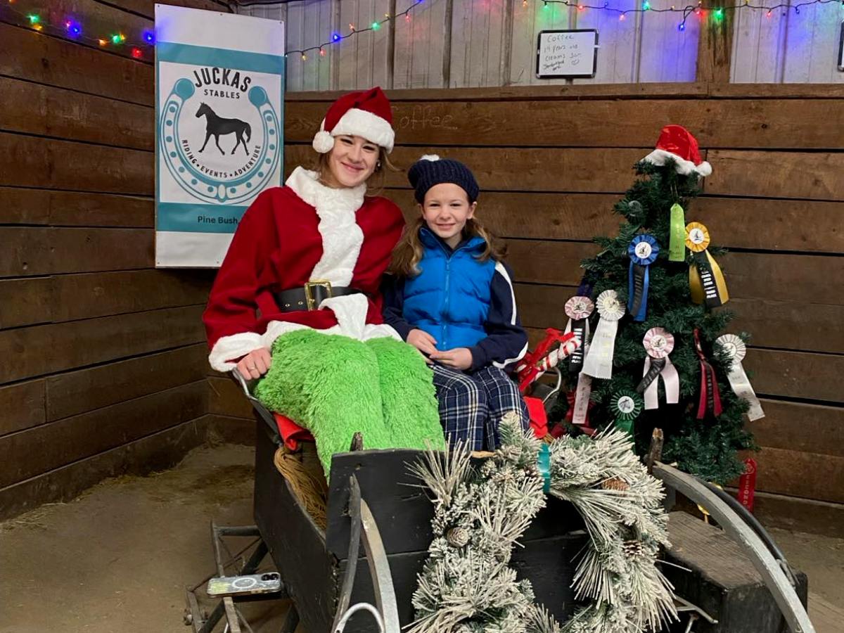 Tessa Allen riding on the back of a bicycle
