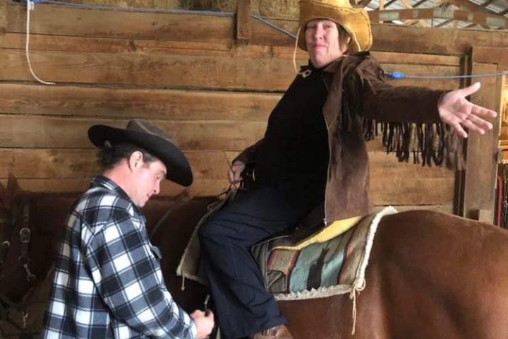 a person sitting on a horse