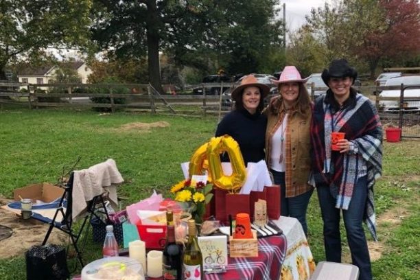 a group of people sitting at a picnic table