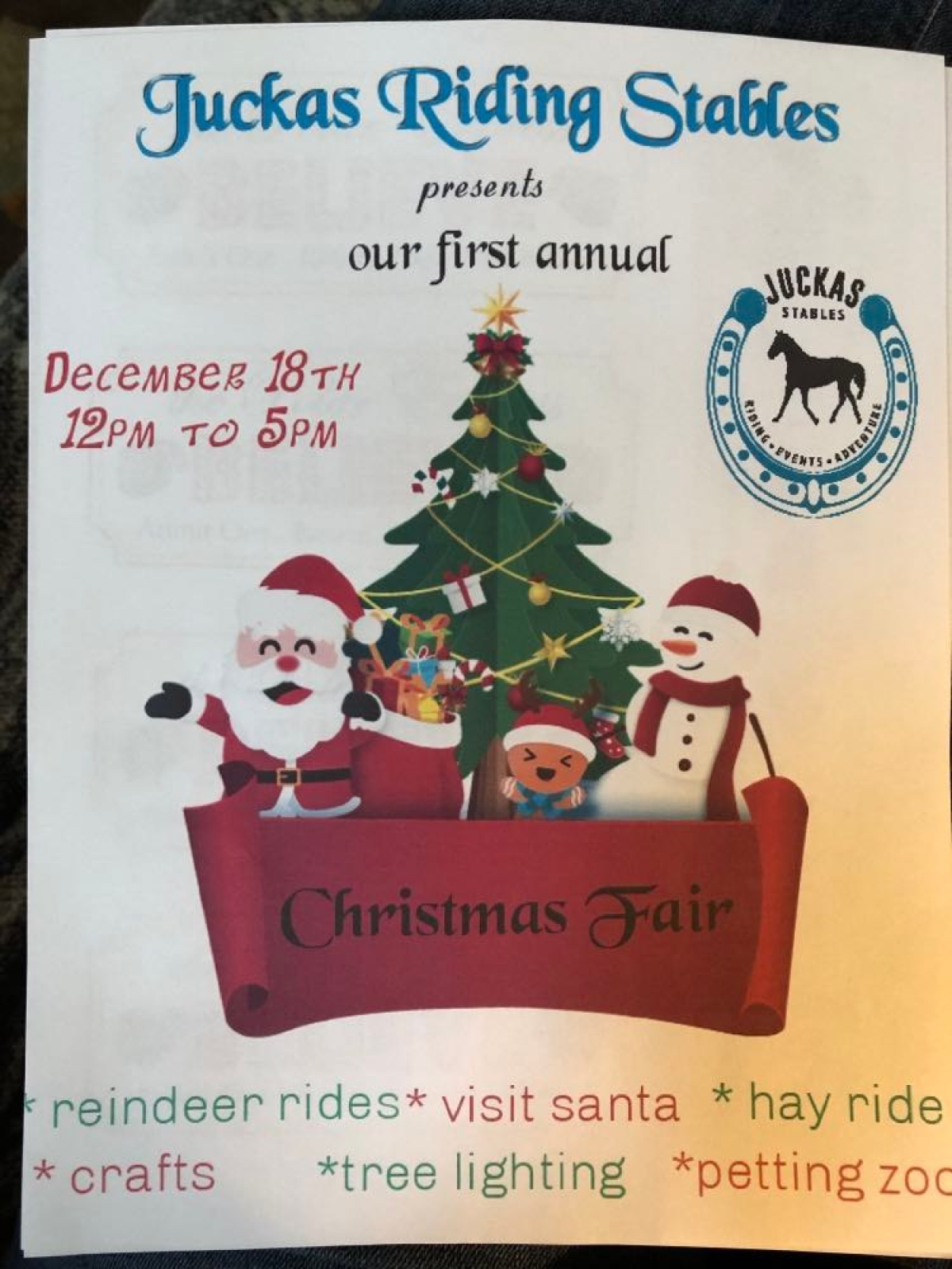 Christmas fair flyer with Santa, snowman, tree, and event details for December 18th at Juckas Riding Stables.